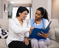 Healthcare provider and patient discussing medical records