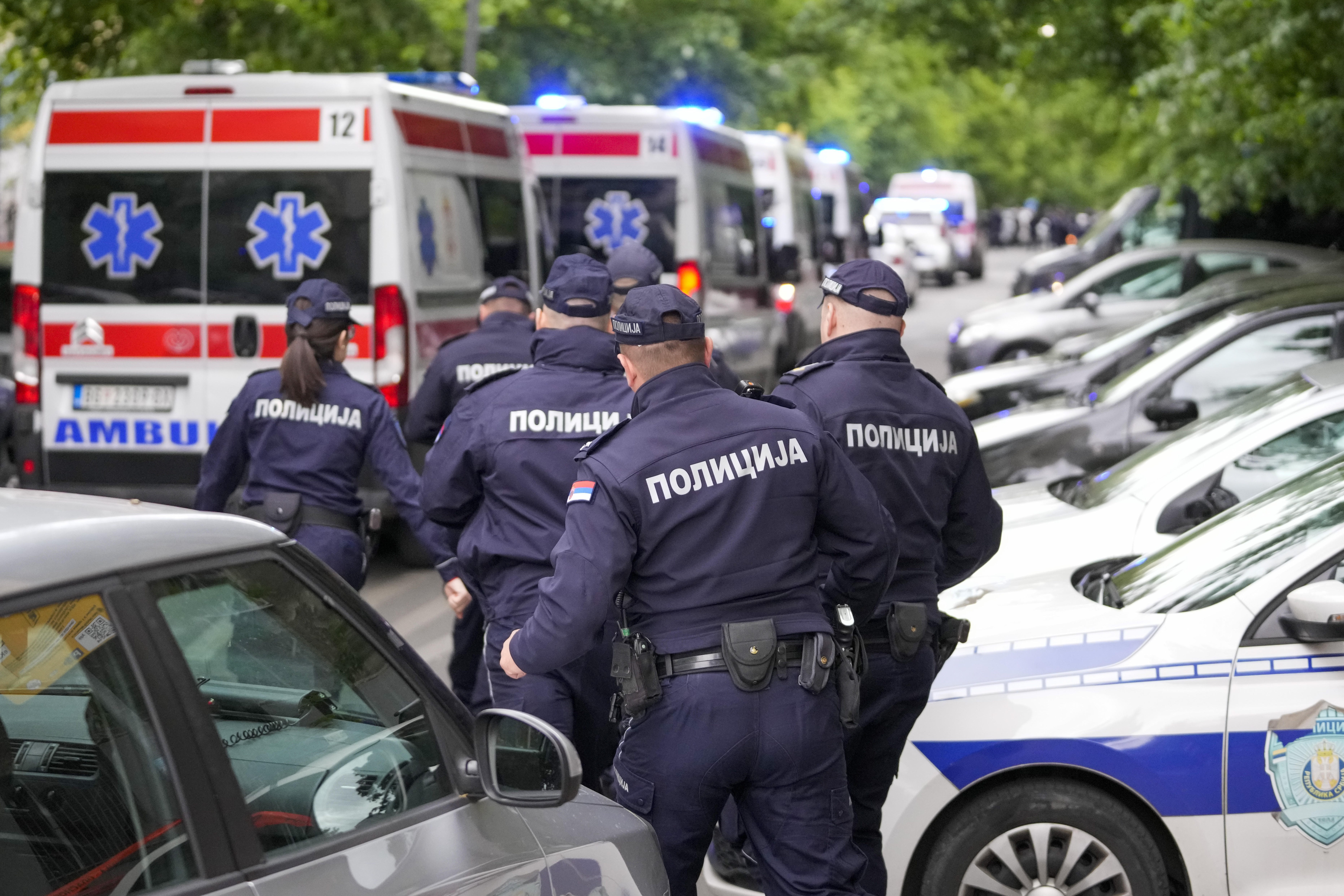 Police officers block the streets surrounding the Vladislav Ribnikar school in Belgrade, Serbia