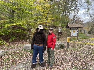 Smokey Bear and Ranger Martin posing for a photo at Balsam Lake Mountain