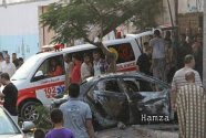 Gaza ambulance at scene of one of six attacks on Gaza ans Islamic Jihad vehicles Sunday morning.