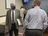 FILE - In this Wednesday, June 24, 2020, file photo, Nevada Gov. Steve Sisolak exits a news conference at the Nevada State Legislature in Carson City, Nev. Sisolak announced Nevada would join California, Washington and North Carolina in requiring individuals wear masks in public places to contain the spread of the coronavirus. (AP Photo/Samuel Metz, File)