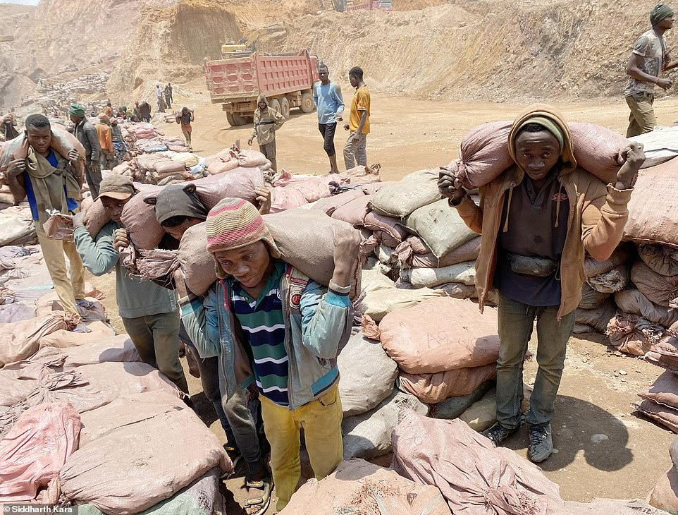 Back-breaking work for the young men and boys who carry sacks of cobalt to be sold