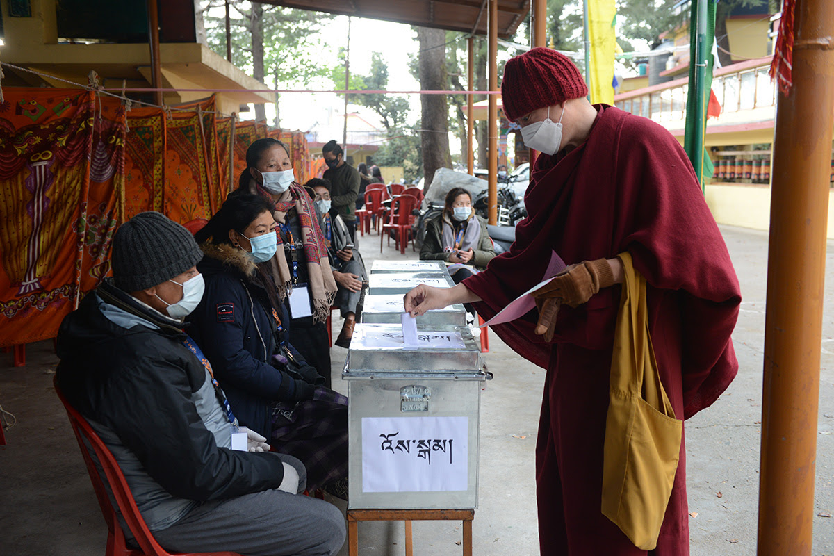 An exile Tibetan monk casts his vote in the preliminary round of elections to choose a new Sikyong and members of the Parliament at a polling station in McLeod Ganj, India, on 3 January 2021.