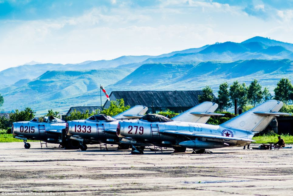 Danish photographer Pedersen said he didn't believe any of the stories the tour guides told him, and noticed that fake buildings had been set up to trick him (pictured, jets on a runway in Chilbosan)