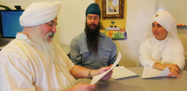 SikhNet Staff reading