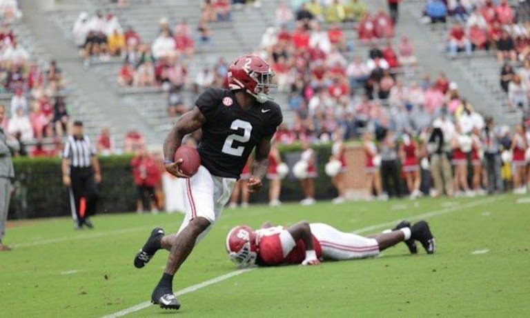 Alabama QB Jalen Milroe (#2) avoids a sack for a big run in 2022 A-Day Game