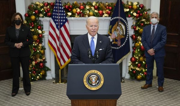 President Joe Biden speaks about the COVID-19 variant named omicron, in the Roosevelt Room of the White House, Monday, Nov. 29, 2021, in Washington, as Vice President Kamala Harris and Dr. Anthony Fauci, director of the National Institute of Allergy and Infectious Diseases listen. (AP Photo/Evan Vucci)