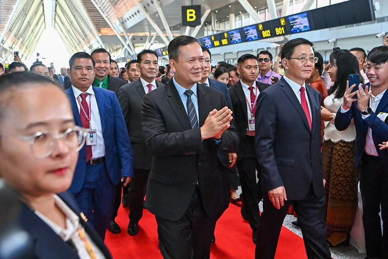 Cambodia’s Prime Minister Hun Manet, center left, and China's Yunnan Province Governor Wang Yubo walk during the inauguration of the Chinese-funded Siem Reap-Angkor International Airport in Siem Reap province on Nov. 16, 2023. (Tang Chhin Sothy/AFP)