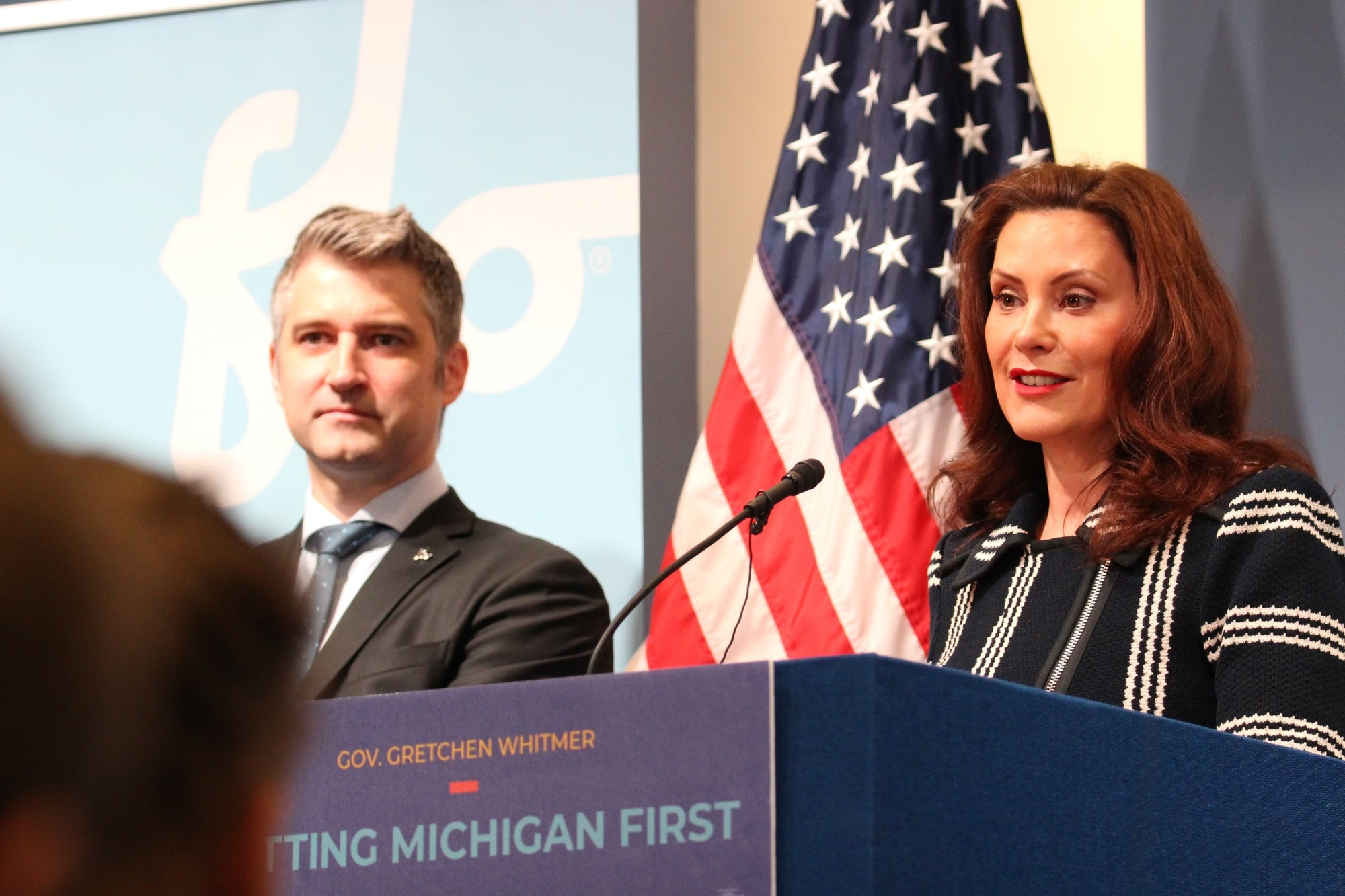 Gov. Whitmer speaks at podium during FLO event 