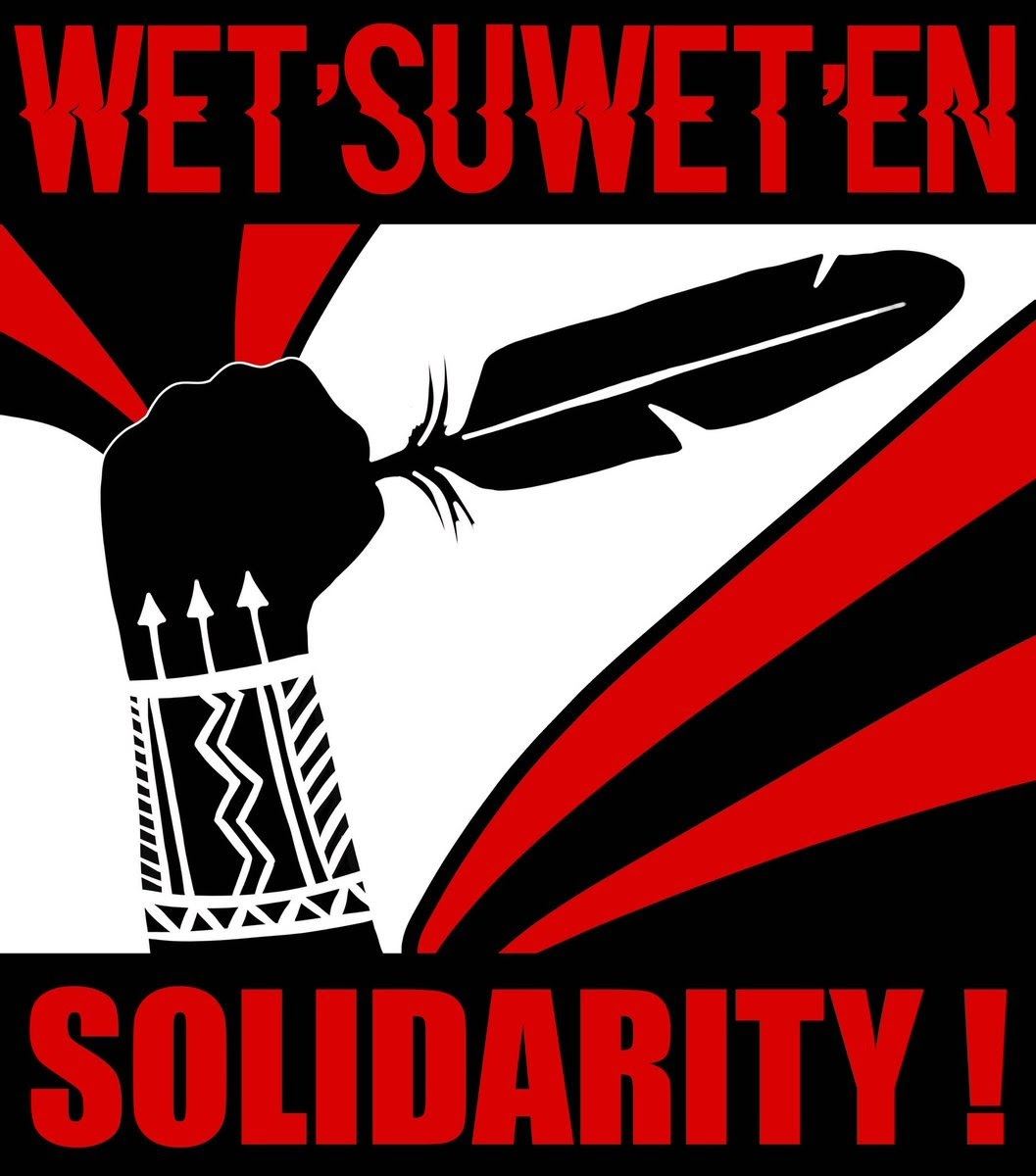 Red, black, and white, bold energetic lines. A fist with a tattooed wrist raises a feather, in silhouette. Text: Wet'suwet'en Solidarity!