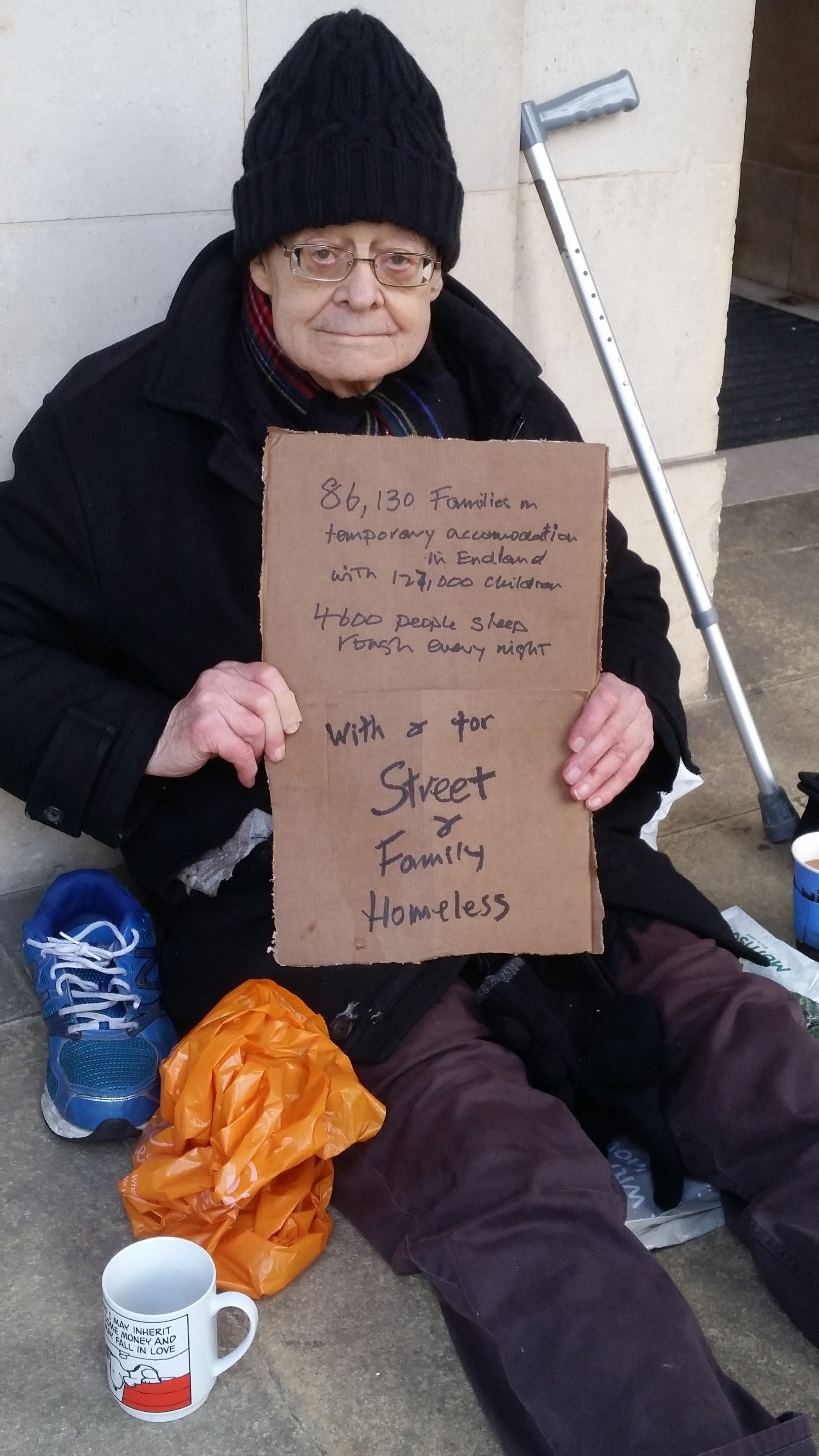 A picture of Rev Paul begging in front of Church House for the street and family homeless