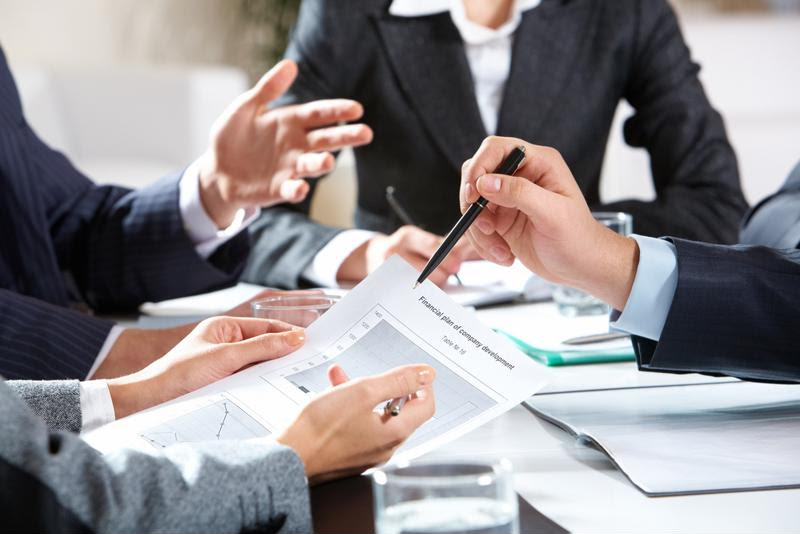 Employees communicating in a meeting.