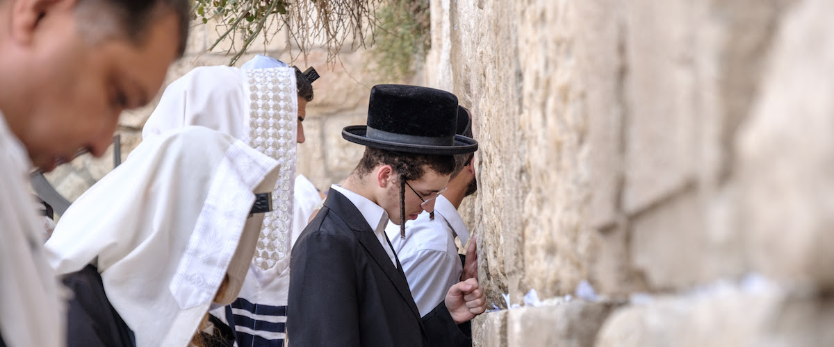 Jewish men praying at the Western Wall