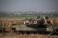 IDF soldiers in a field outside Kibbutz Nahal Oz near the Gaza border.