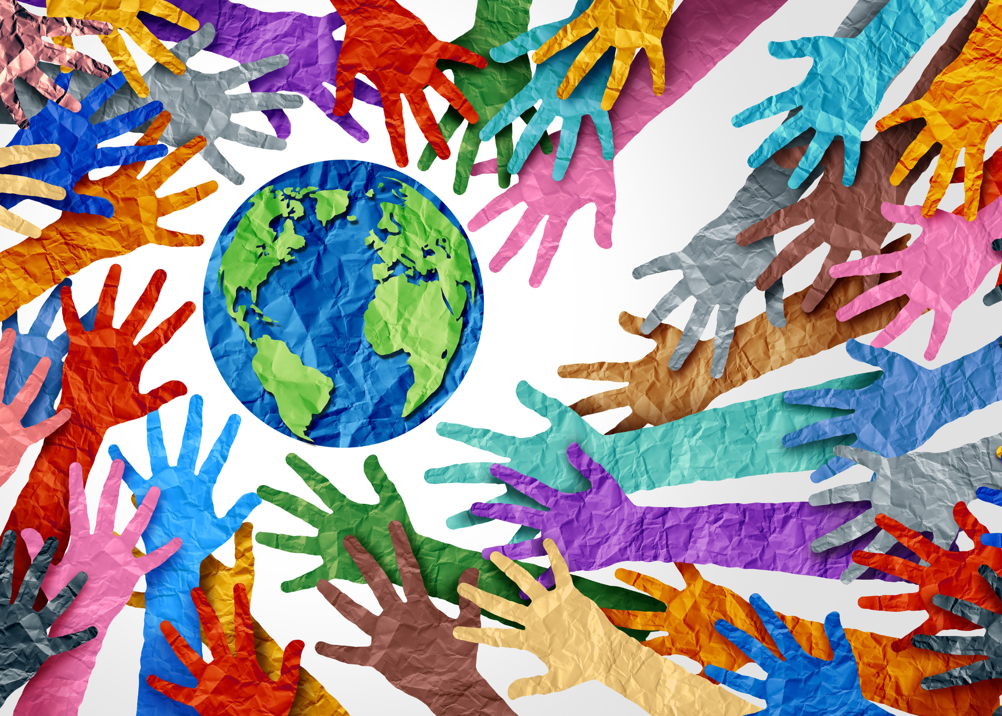 Photo of papercraft hands in a wide variety of bright colors reaching toward a papercraft earth.