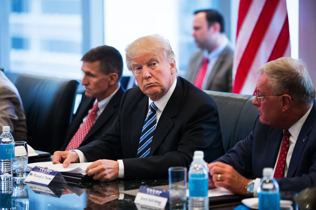 Donald J. Trump at a meeting on national security in New York on Wednesday, with Michael T. Flynn, left, and Keith Kellogg, retired American generals.