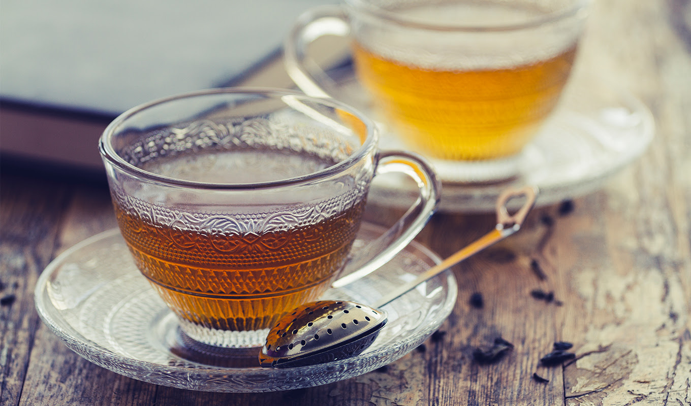 green tea vs. black tea: Cup of green tea on a vintage rustic wood blurry or bokeh background