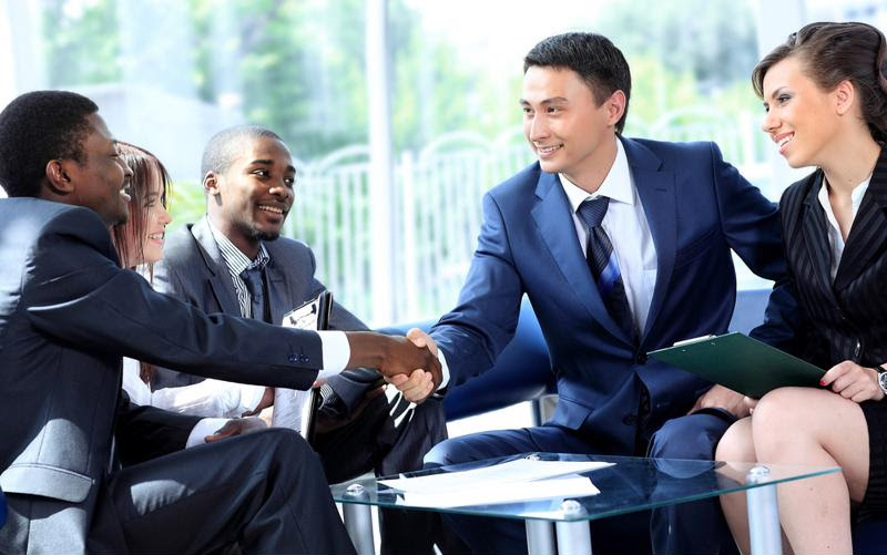 A group of businesspeople holding a discussion.