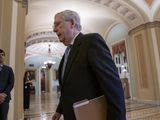 Senate Majority Leader Mitch McConnell, R-Ky., walks to the chamber as lawmakers negotiate on the emergency coronavirus response legislation, at the Capitol in Washington, Wednesday, March 18, 2020. (AP Photo/J. Scott Applewhite)