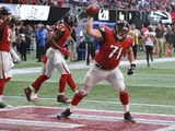 Atlanta Falcons guard Wes Schweitzer (71) spikes the ball after Tevin Coleman&#39;s touchdown catch against the Tampa Bay Buccaneers during the fourth quarter of an NFL football game Sunday, Oct 14, 2018, in Atlanta. (Curtis Compton/Atlanta Journal-Constitution via AP) ** FILE **