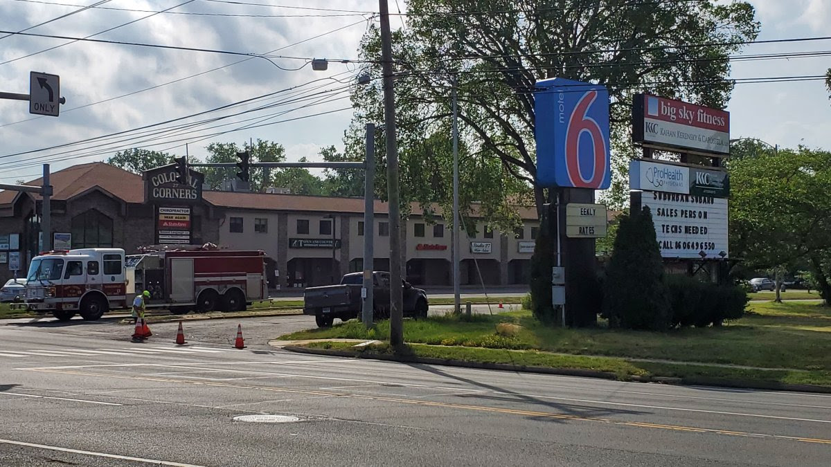 A view from the street of the motel where an owner was shot over a pool pass A view from the street of the motel where an owner was shot over a pool pass