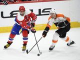 Washington Capitals left wing Alex Ovechkin (8), of Russia, works for the puck next to Philadelphia Flyers center Kevin Hayes (13) during the second period of an NHL hockey game Saturday, Feb. 8, 2020, in Washington. (AP Photo/Nick Wass) ** FILE **