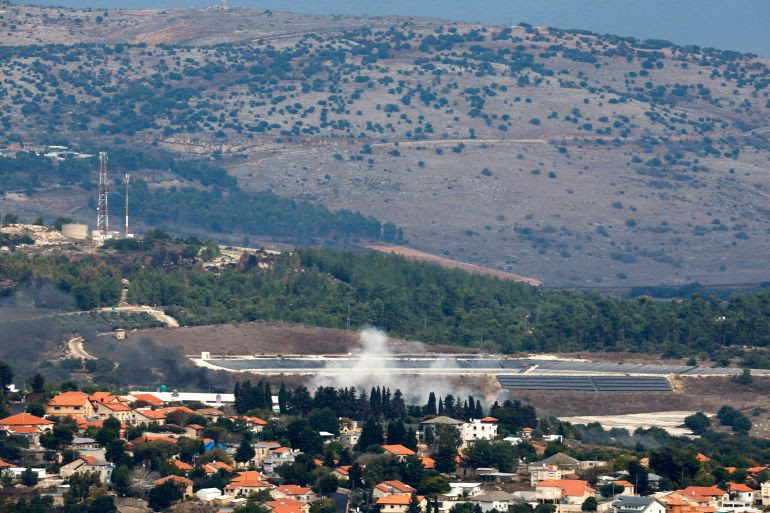 Smoke rises behind the village of Dovev as seen from Israel-Lebanon border in northern Israel