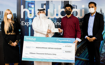 First Prize winner Mohammed Irfan Hazari receiving the cheque from Dubai Economy Official Mr.Yousef Al Shebani