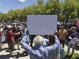 In this May 25, 2021, file photo, a man holds up a sign against critical race theory during a protest outside a Washoe County School District board meeting in Reno, Nev. (Andy Barron/Reno Gazette-Journal via AP) **FILE**