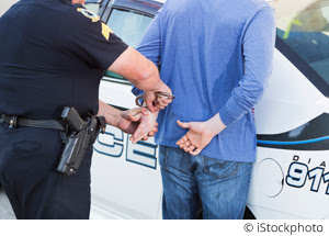 Policeman arresting a criminal.