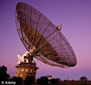 We could be oblivious to their messages from aliens, because humanity is not yet able to pick up the signals. This is according to Dr Nathalie Cabro (right), who is leading the hunt for alien life at the Seti Institute. Pictured on the left is the Parkes Radio Telescope that has picked up strange radio bursts from space