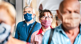 Small group of people wearing masks