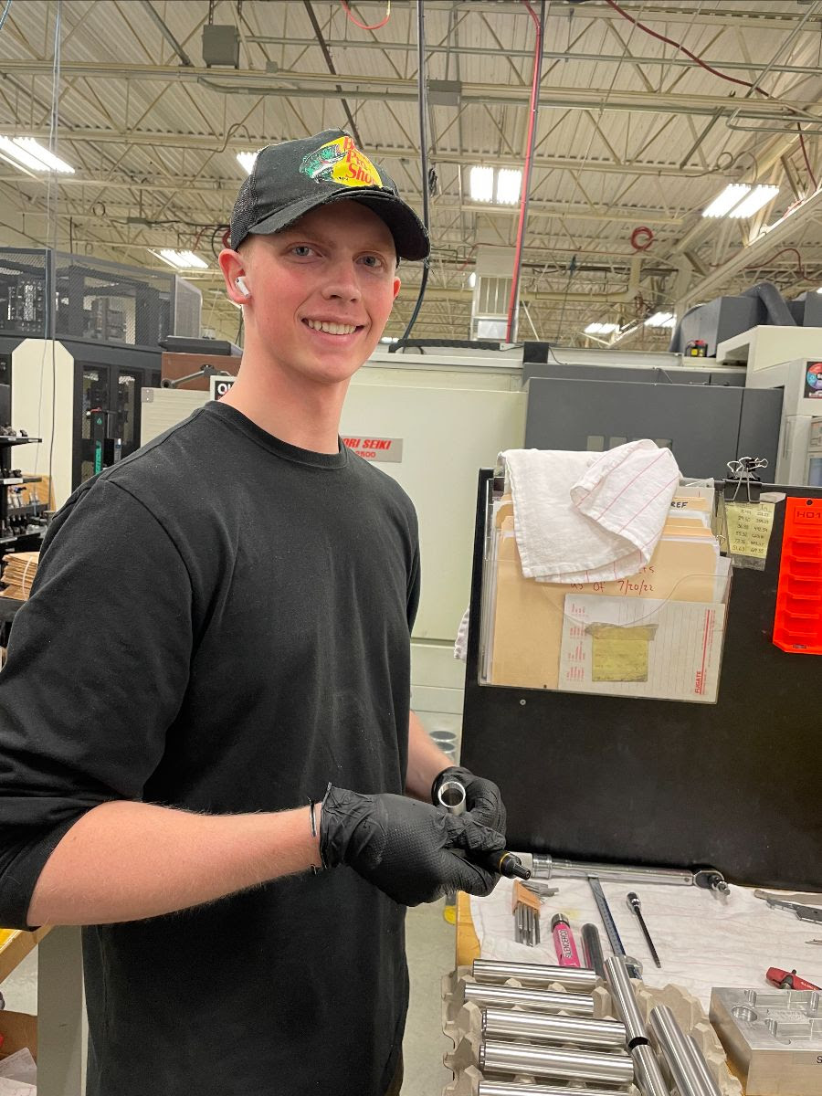 A young man working in the CNC Machining Tech youth apprenticeship