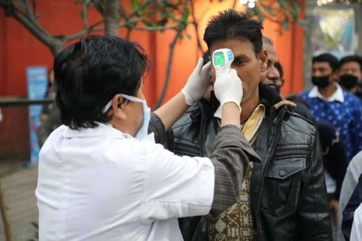 A health worker conducts temperature checks at the India-Bhutan border. From Prime Minister's Office - PMO, Bhutan Facebook