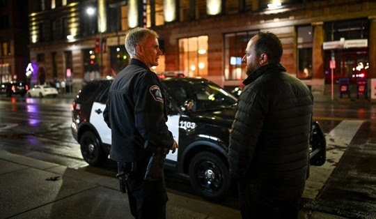 Council Member Fletcher downtown with Minneapolis police officer