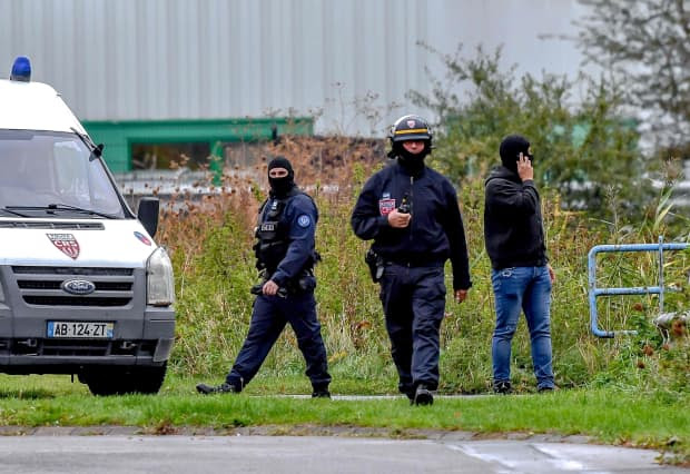 Policemen in Grande Synthe, France, Oct. 2.