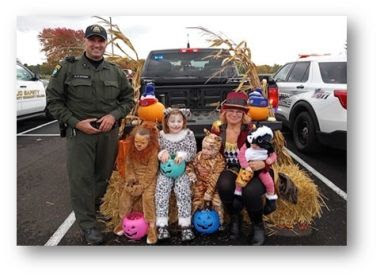 ECO stands with kids dressed up as animals during halloween event