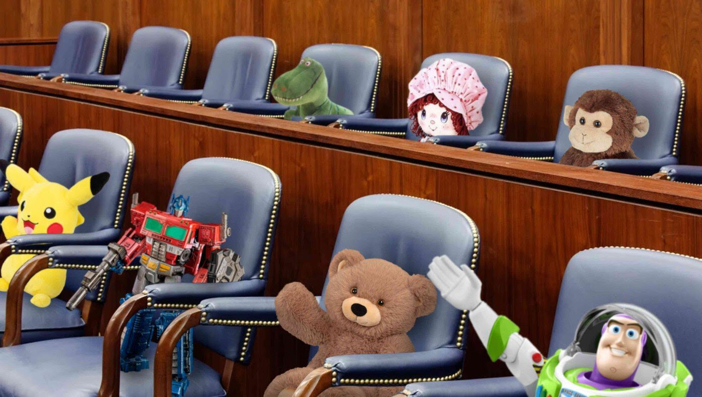Jan 6 Panel Continues To Hold Hearings For Stuffed Animals And Action Figures They Arranged In Chairs