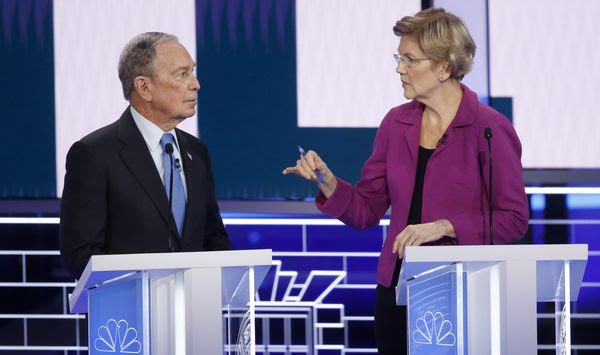 Democratic presidential candidates, former New York City Mayor Mike Bloomberg, left, and Sen. Elizabeth Warren, D-Mass., talk before a Democratic presidential primary debate Wednesday, Feb. 19, 2020, in Las Vegas, hosted by NBC News and MSNBC. (AP Photo/John Locher)