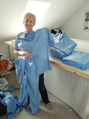 woman holding homemade hospital scrubs
