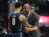 Georgetown head coach Patrick Ewing talks with guard Jahvon Blair (0) after an altercation between players in the second half of an NCAA college basketball game against Butler in Indianapolis, Saturday, Feb. 15, 2020. A double technical was called. Georgetown defeated Butler 73.66. (AP Photo/Michael Conroy)