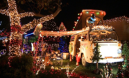 House on Candy Cane Lane covered in Christmas Lights with a California theme