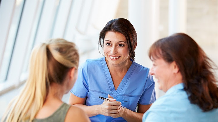 The figure shows an adolescent and her mother speaking with a health care provider.