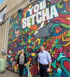 Brian and Twila in front of You Betcha mural