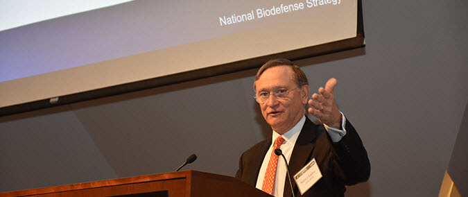 Dr. Kadlec speaking at the podium duirng the National Biodefense Summit