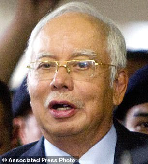 Former Malaysian Prime Minister Najib Razak is facing corruption charges. He is pictured leaving court in September