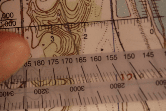 land navigation protractor lined up on topo topographic map