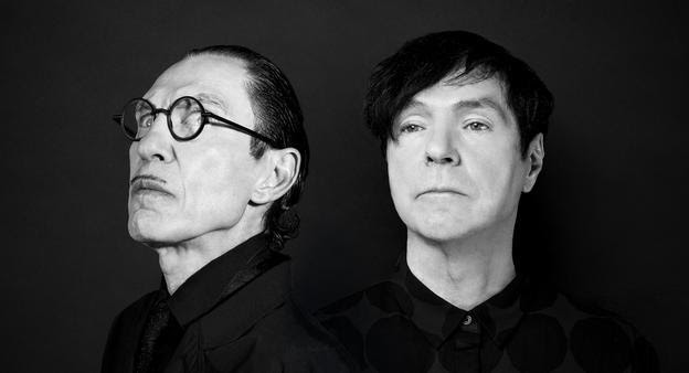 Ron and Russel Mael pose for a black and white photograph