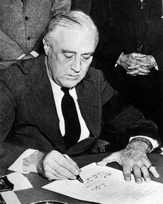Franklin_Roosevelt_signing_declaration_of_war_against_Japan.jpg