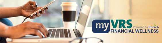 An image of a pair of female hands holding a cellphone and typing on a laptop keyboard at the same time. A coffee cup sits on the table next to the laptop. To the right of the laptop the my VRS Financial Wellnes Powered by Enrich logo is superimposed over the image.